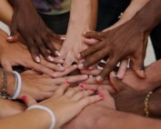 Hands in a circle on top of each other