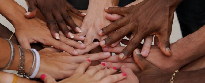 Hands in a circle on top of each other