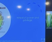 Screenshot of a woman giving a virtual presentation. The slide she is showing has text that says wheel of power and privilege with a graphic.
